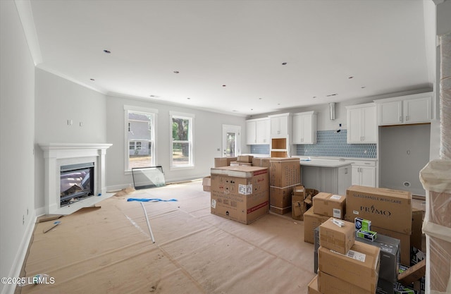 1 Alumni Rd, Beaufort, SC 29907 - living room featuring baseboards, a fireplace with flush hearth, and ornamental molding