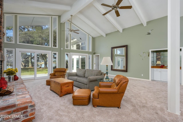 living room featuring beam ceiling, ceiling fan, carpet flooring, and high vaulted ceiling