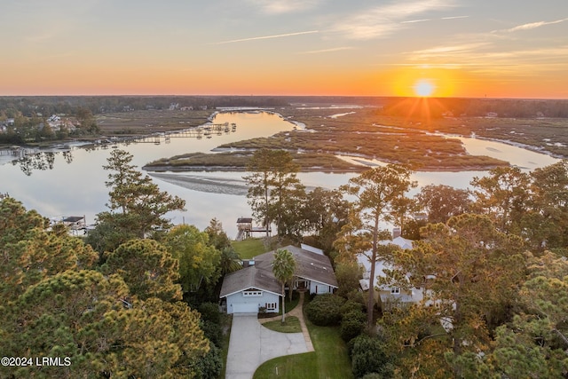 aerial view at dusk with a water view