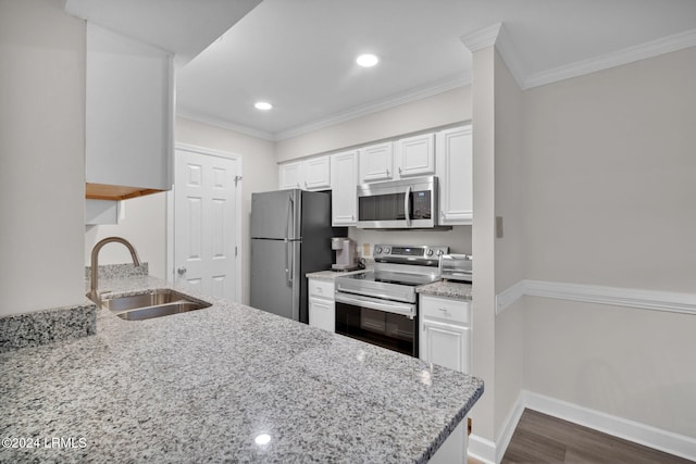 kitchen with sink, white cabinets, ornamental molding, stainless steel appliances, and light stone countertops