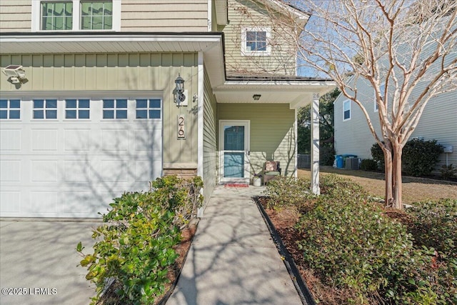 view of exterior entry with a garage