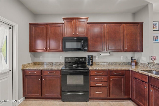 kitchen with light stone countertops, sink, and black appliances