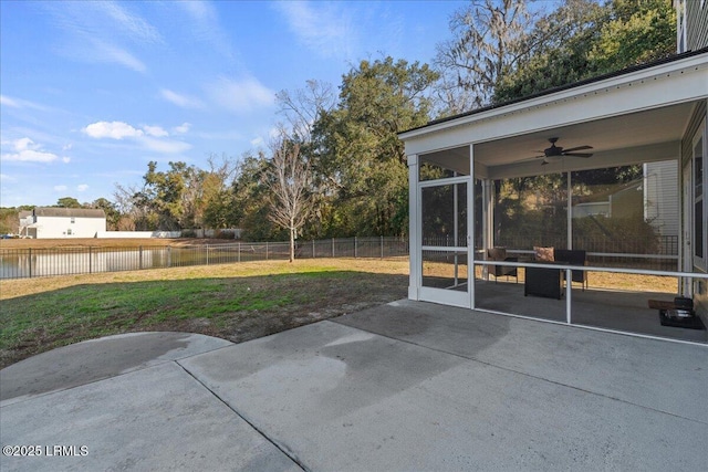 view of patio / terrace featuring a sunroom and ceiling fan