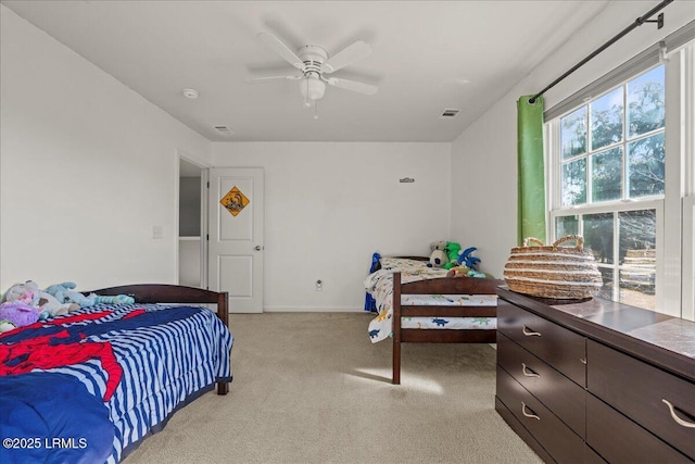 bedroom featuring light carpet and ceiling fan