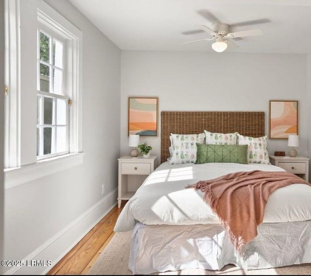 606 Carteret St Unit 2, Beaufort, SC 29902 - bedroom featuring baseboards, a ceiling fan, and wood finished floors