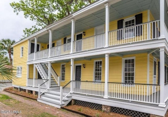 606 Carteret St Unit 2, Beaufort, SC 29902 - view of front of house featuring stairway and covered porch