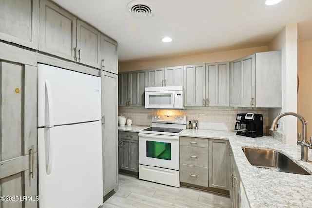 45 Queens Folly Rd Unit 794, Hilton Head Island, SC 29928 - kitchen featuring white appliances, gray cabinetry, light stone countertops, tasteful backsplash, and recessed lighting