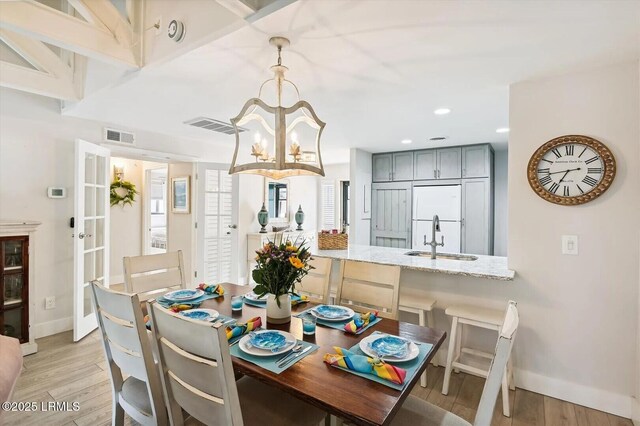 45 Queens Folly Rd Unit 794, Hilton Head Island, SC 29928 - dining space with a chandelier, light wood-type flooring, and recessed lighting