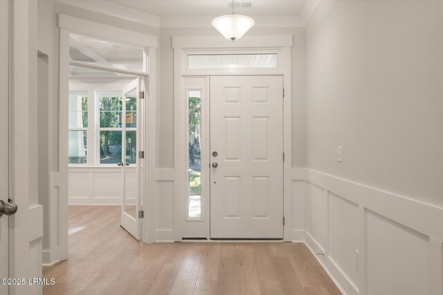 29 Fairfield Rd, Beaufort, SC 29907 - foyer entrance featuring crown molding and light hardwood / wood-style floors