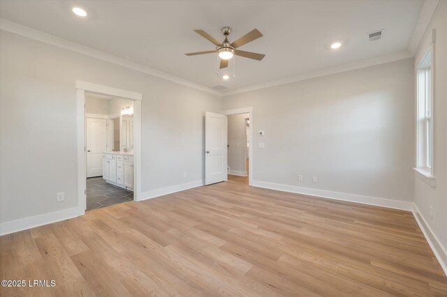 29 Fairfield Rd, Beaufort, SC 29907 - unfurnished bedroom with crown molding, ensuite bathroom, ceiling fan, and light hardwood / wood-style floors