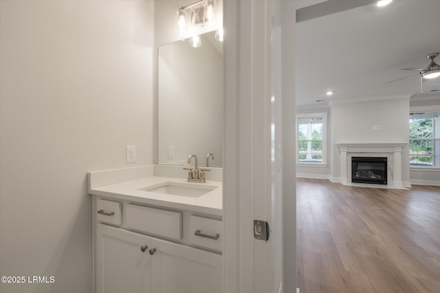 29 Fairfield Rd, Beaufort, SC 29907 - bathroom with crown molding, ceiling fan, a healthy amount of sunlight, and hardwood / wood-style floors