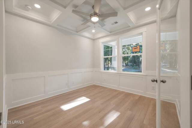 29 Fairfield Rd, Beaufort, SC 29907 - empty room featuring coffered ceiling, ceiling fan, light hardwood / wood-style floors, and beamed ceiling