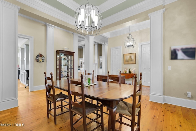 44 Richland Dr, Bluffton, SC 29910 - dining room featuring a chandelier, ornate columns, and light wood-style floors