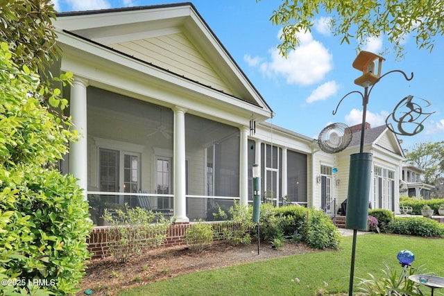 44 Richland Dr, Bluffton, SC 29910 - view of home's exterior with a yard and a sunroom