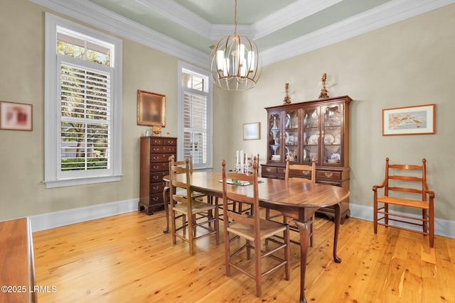 44 Richland Dr, Bluffton, SC 29910 - dining area with ornamental molding, light wood-type flooring, a notable chandelier, and a healthy amount of sunlight