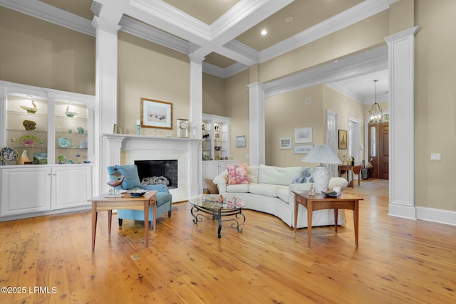 44 Richland Dr, Bluffton, SC 29910 - living room featuring decorative columns, a fireplace, and ornamental molding