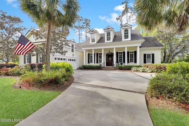 44 Richland Dr, Bluffton, SC 29910 - new england style home with a porch, concrete driveway, and a front yard