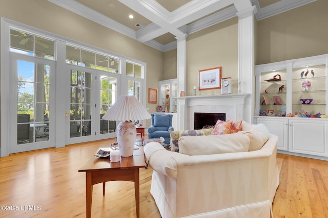 44 Richland Dr, Bluffton, SC 29910 - living room featuring ornamental molding, a fireplace, light wood-style flooring, beam ceiling, and coffered ceiling