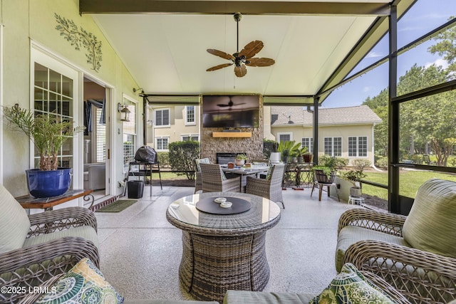300 Persimmon Cir, Hardeeville, SC 29927 - sunroom featuring a ceiling fan, vaulted ceiling, plenty of natural light, and an outdoor living space with a fireplace