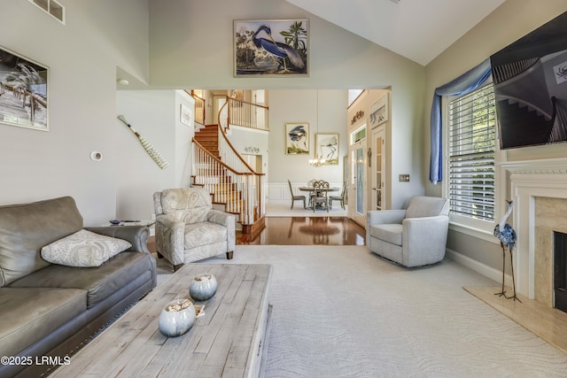300 Persimmon Cir, Hardeeville, SC 29927 - living area with stairs, a fireplace, high vaulted ceiling, french doors, and carpet