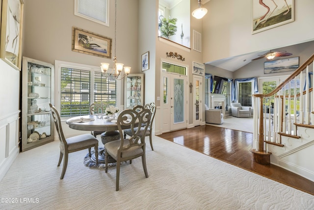 300 Persimmon Cir, Hardeeville, SC 29927 - dining room with stairway, a chandelier, wood finished floors, and a high ceiling