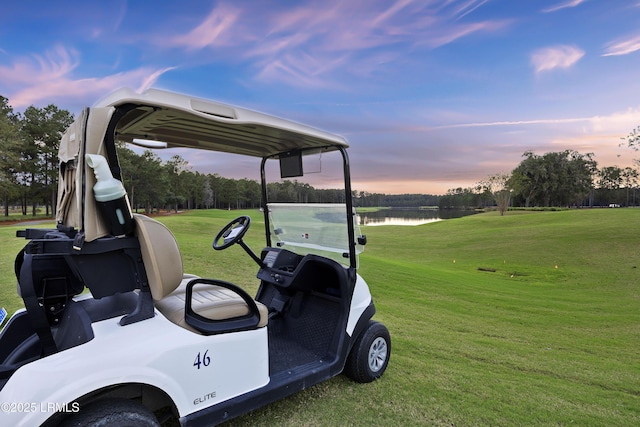 300 Persimmon Cir, Hardeeville, SC 29927 - yard at dusk featuring a water view, a lawn, and view of golf course