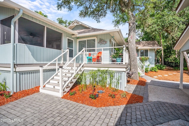 106 Sand Piper Run, Fripp Island, SC 29920 - view of front of home with stairway and a sunroom