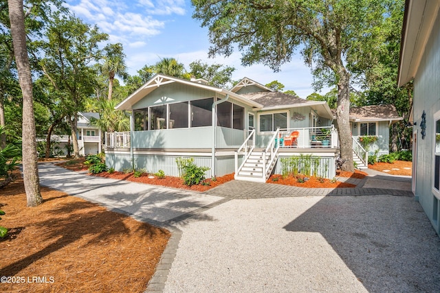 106 Sand Piper Run, Fripp Island, SC 29920 - manufactured / mobile home with a sunroom and stairway