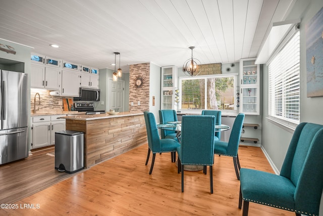 106 Sand Piper Run, Fripp Island, SC 29920 - dining area with a chandelier, light wood finished floors, and wood ceiling