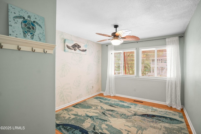 106 Sand Piper Run, Fripp Island, SC 29920 - spare room with ceiling fan, wood finished floors, and a textured ceiling