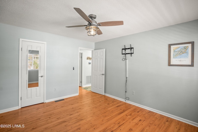 106 Sand Piper Run, Fripp Island, SC 29920 - unfurnished bedroom featuring light wood-type flooring and a textured ceiling