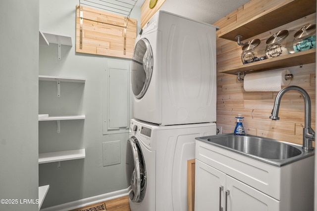 106 Sand Piper Run, Fripp Island, SC 29920 - laundry room featuring stacked washer and clothes dryer and wood finished floors