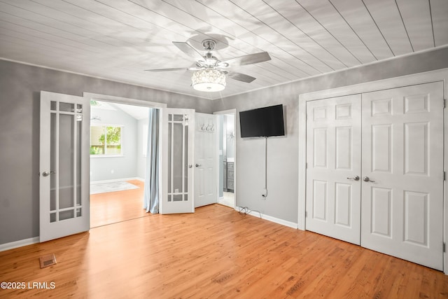 106 Sand Piper Run, Fripp Island, SC 29920 - unfurnished bedroom with wood finished floors, a closet, wooden ceiling, connected bathroom, and a ceiling fan