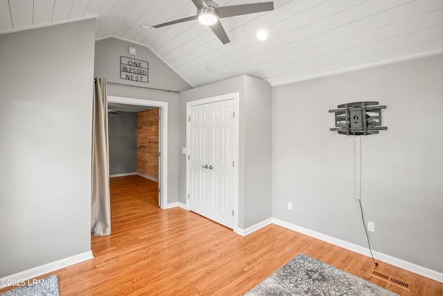 106 Sand Piper Run, Fripp Island, SC 29920 - unfurnished bedroom featuring vaulted ceiling, light wood-type flooring, a closet, wood ceiling, and a ceiling fan