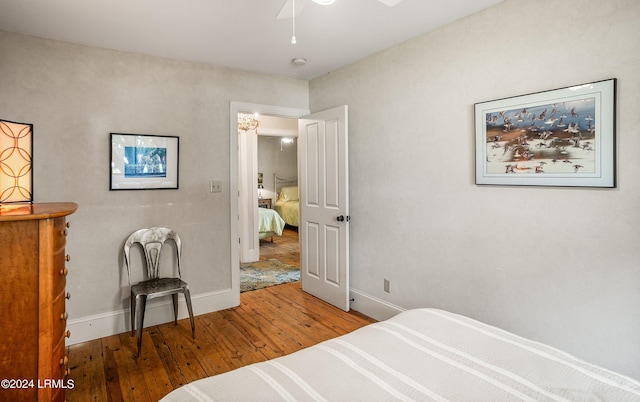 bedroom featuring wood-type flooring and ceiling fan