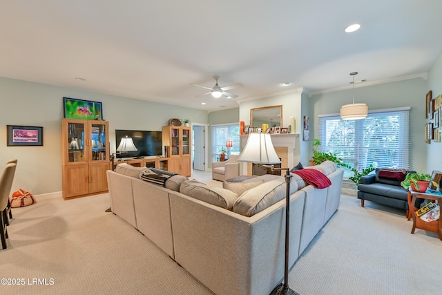 1120 Palmetto Pt, Dataw Island, SC 29920 - living room featuring light colored carpet, a ceiling fan, plenty of natural light, recessed lighting, and crown molding