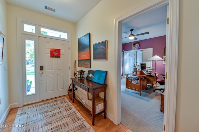 1120 Palmetto Pt, Dataw Island, SC 29920 - entrance foyer featuring light wood-style flooring and a ceiling fan