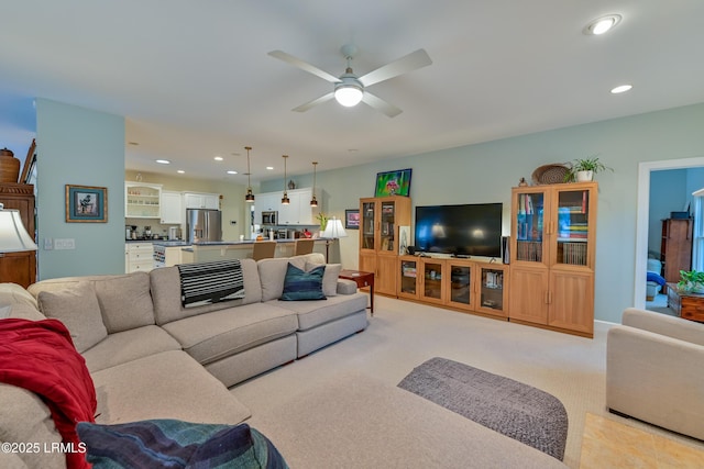 1120 Palmetto Pt, Dataw Island, SC 29920 - living room featuring light colored carpet, a ceiling fan, and recessed lighting