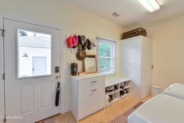 1120 Palmetto Pt, Dataw Island, SC 29920 - laundry area with light tile patterned flooring
