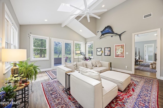 51 White Oaks Cir, Bluffton, SC 29910 - living room with ceiling fan, beam ceiling, baseboards, a skylight, and wood finished floors