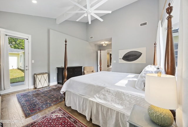 51 White Oaks Cir, Bluffton, SC 29910 - bedroom with access to exterior, wood finished floors, beamed ceiling, baseboards, and high vaulted ceiling