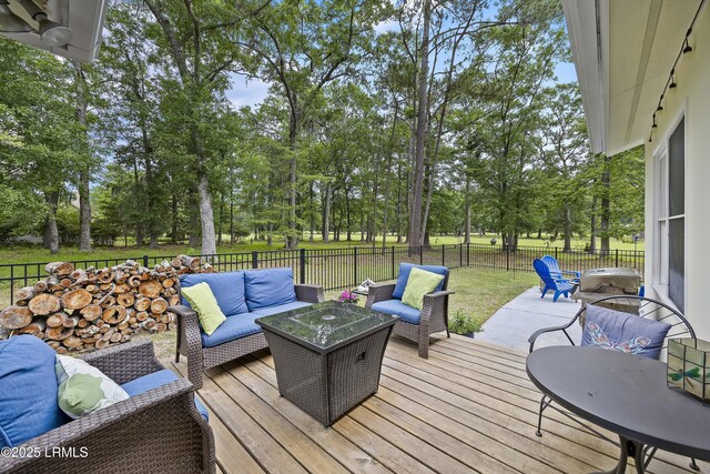 51 White Oaks Cir, Bluffton, SC 29910 - wooden terrace with outdoor lounge area, view of scattered trees, a fenced backyard, and outdoor dining space