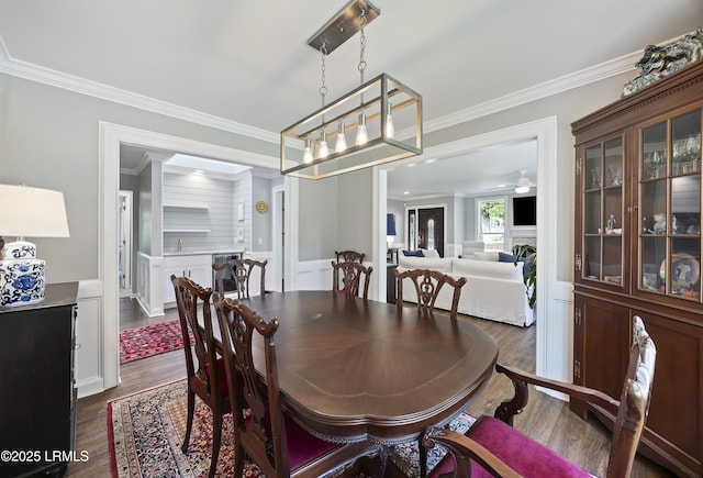 51 White Oaks Cir, Bluffton, SC 29910 - dining area with dark wood-style flooring, crown molding, and a ceiling fan
