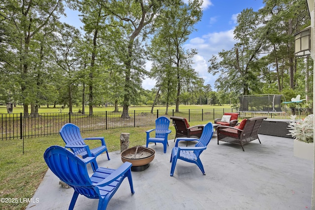 51 White Oaks Cir, Bluffton, SC 29910 - view of patio featuring a trampoline, view of wooded area, and an outdoor living space with a fire pit