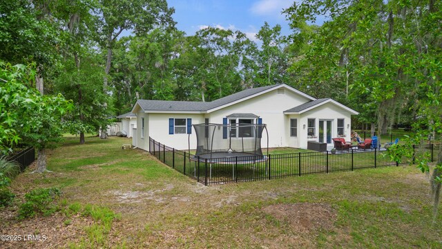 51 White Oaks Cir, Bluffton, SC 29910 - rear view of property featuring a patio, stucco siding, view of scattered trees, and outdoor lounge area