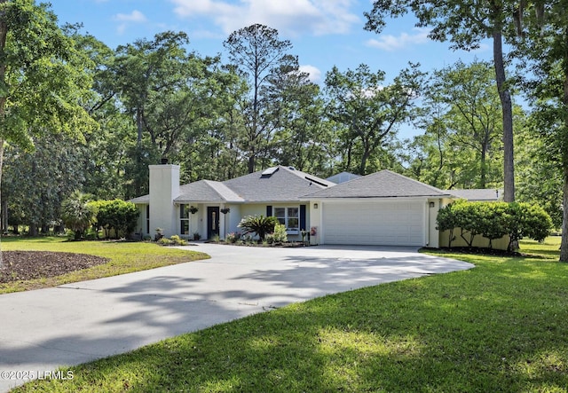 51 White Oaks Cir, Bluffton, SC 29910 - single story home with a chimney, concrete driveway, a garage, a front lawn, and stucco siding