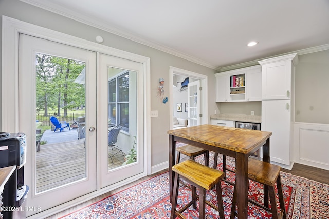 51 White Oaks Cir, Bluffton, SC 29910 - dining space featuring wood finished floors, french doors, and crown molding