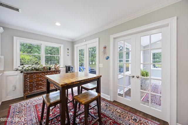 51 White Oaks Cir, Bluffton, SC 29910 - dining space with french doors, dark wood finished floors, ornamental molding, and baseboards