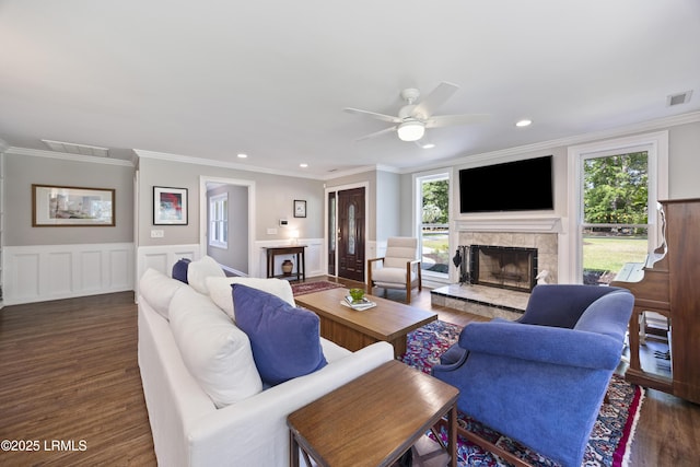 51 White Oaks Cir, Bluffton, SC 29910 - living area with a fireplace with raised hearth, wood finished floors, healthy amount of natural light, crown molding, and ceiling fan