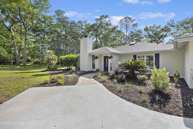51 White Oaks Cir, Bluffton, SC 29910 - view of front of property with stucco siding, a chimney, a front lawn, and a patio area